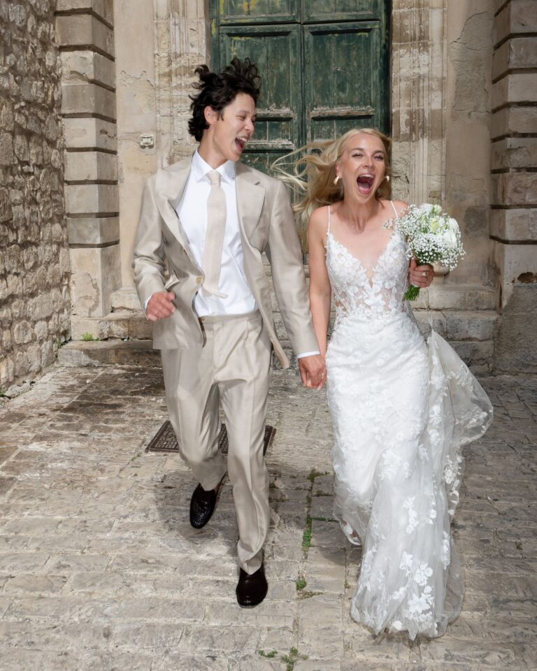 The couple laughing in a stone-lined lane in Sicily, Marco Ficili
