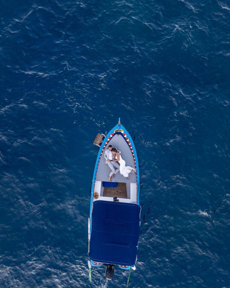 A traditional blue boat seen from above at sea, Marco Ficili