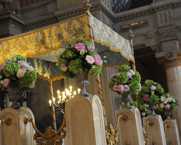 A basilica aisle dressed in white rose and blue delphinium, Rome, Maria Luisa Rocchi Flowers