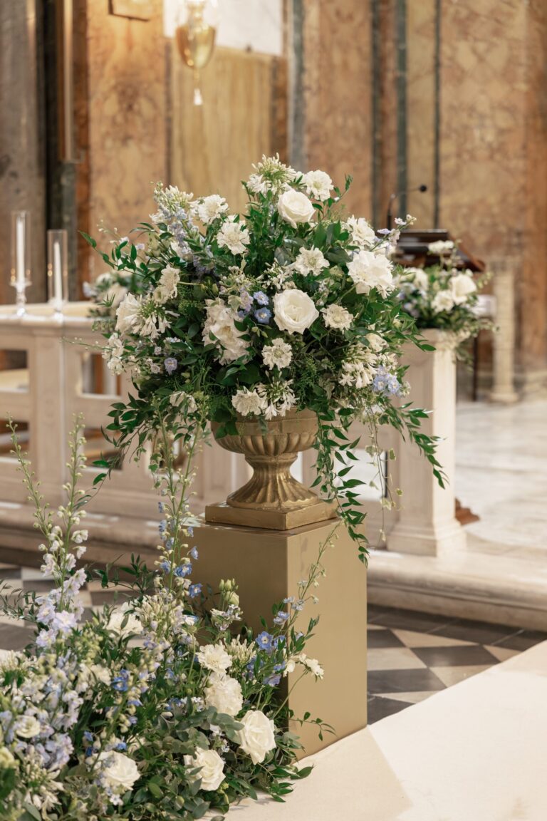 A floral urn of white rose and agapanthus on a gilded pedestal, Maria Luisa Rocchi Flowers