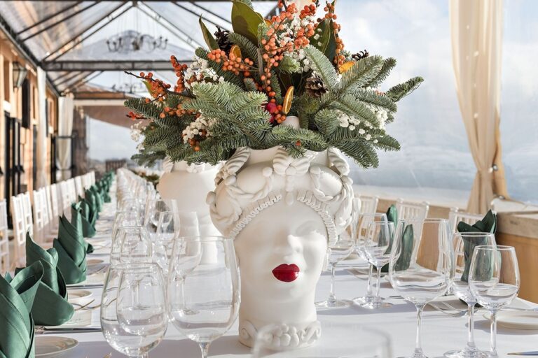 A Sicilian ceramic vase dressed in winter greenery, La Posta Vecchia, Maria Luisa Rocchi Flowers