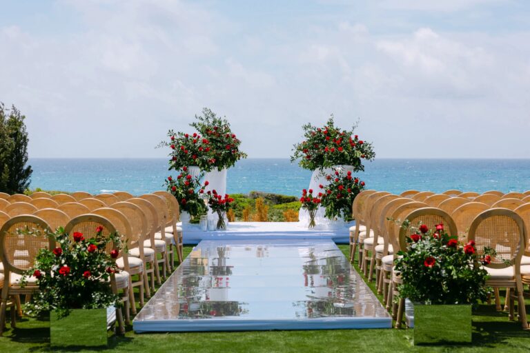 Mirrored aisle with red rose arrangements facing the sea at OZEA, Sea Caves, Paphos, Marry Me Cyprus