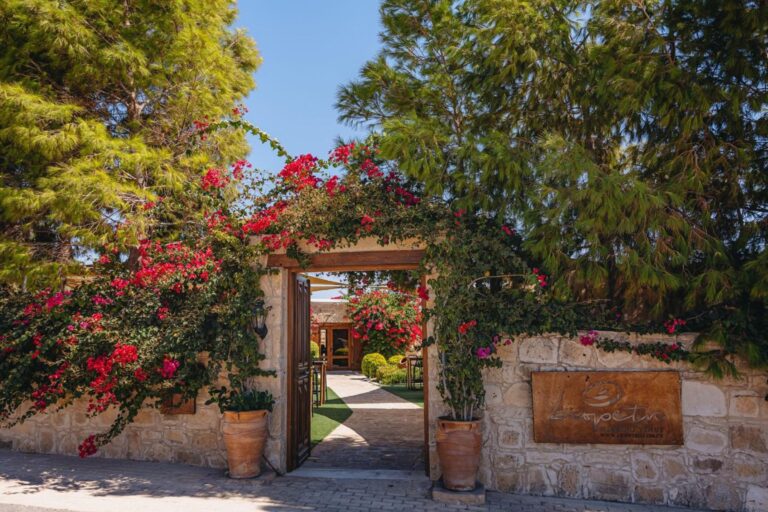 Stone entrance archway with bougainvillea at Liopetro, Kouklia, Marry Me Cyprus