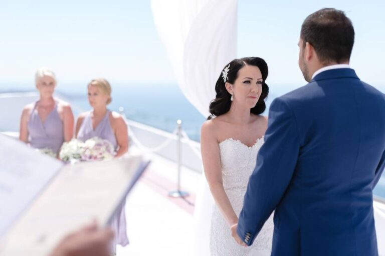 Bride and groom at their ceremony on a white terrace, Marryme in Greece