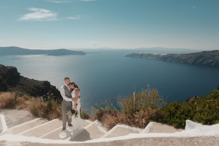 Couple on stone steps above the caldera, Marryme in Greece
