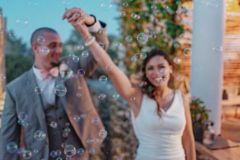 Couple celebrating among soap bubbles, Marryme in Greece