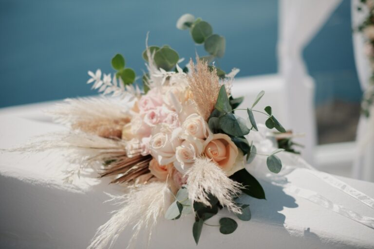 Bouquet of roses, pampas grass and greenery on a white wall, Marryme in Greece