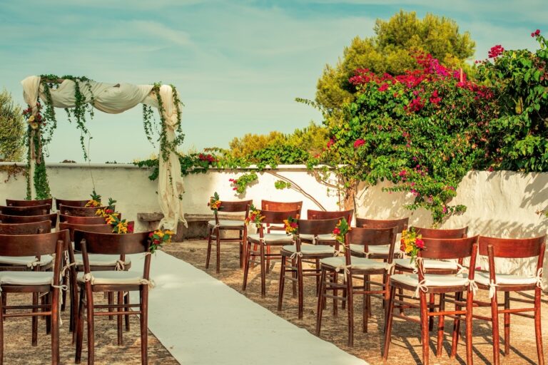 The sea view terrace set for an outdoor ceremony with an aisle, Masseria Spina Resort
