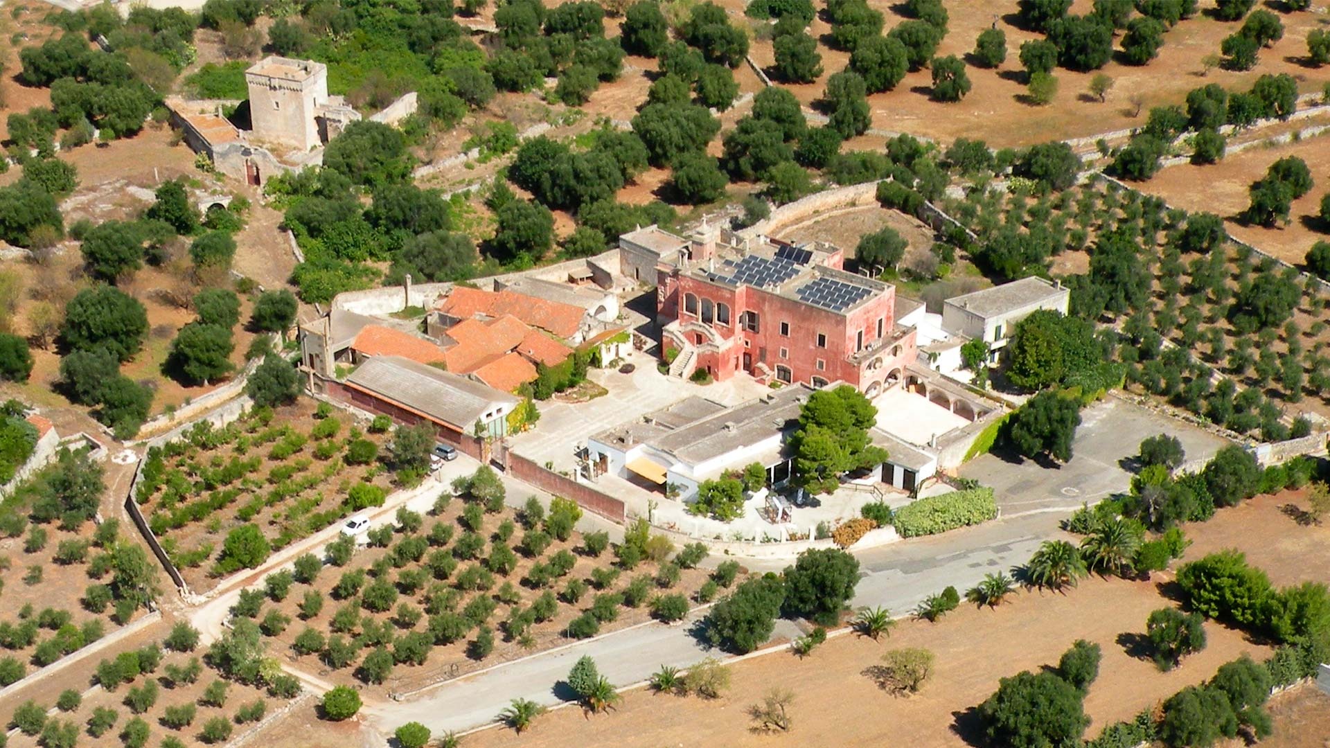 The masseria and its olive groves seen from above, Masseria Spina Resort