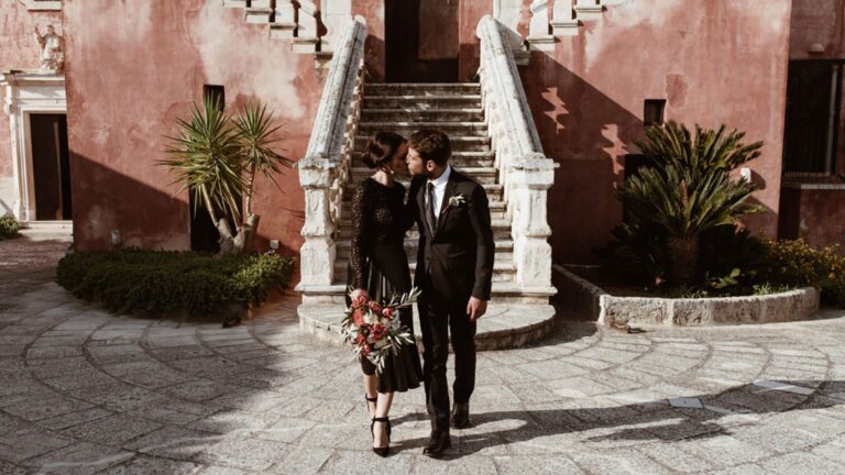 A couple on the stone staircase of the masseria, Masseria Spina Resort
