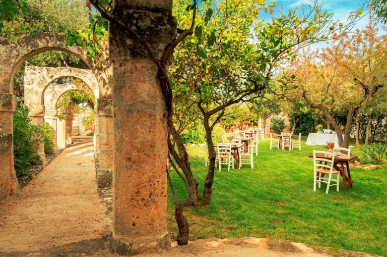 The Arabic garden with tables under the trees, Masseria Spina Resort