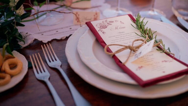 A place setting with a menu card and sprig of rosemary, Masseria Spina Resort