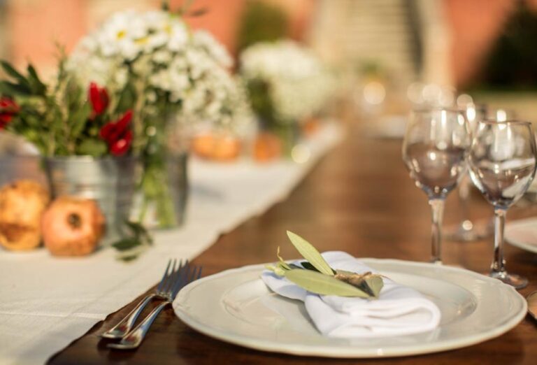 A long table with white flowers and glassware, Masseria Spina Resort