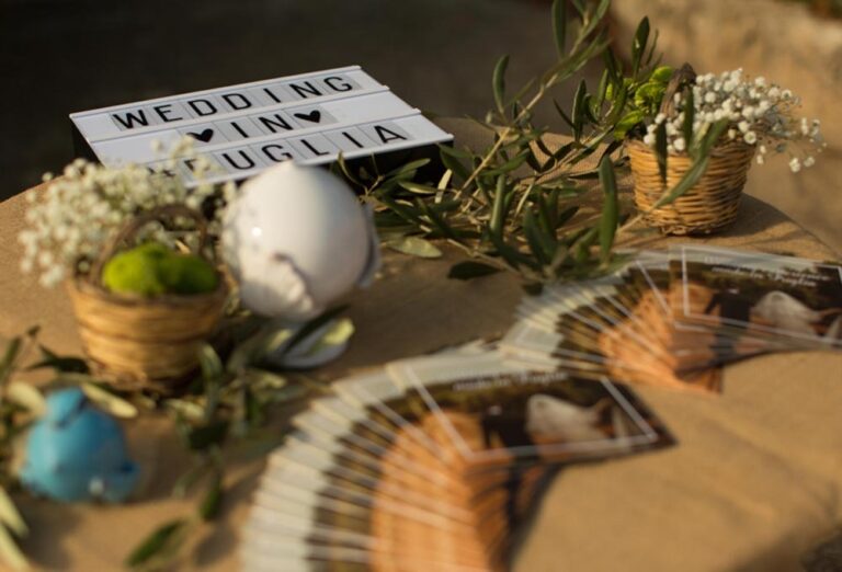 A table with olive branches and a wedding sign, Masseria Spina Resort