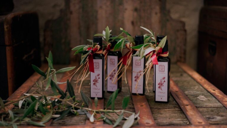 Bottles of olive oil tied with olive sprigs, Masseria Spina Resort