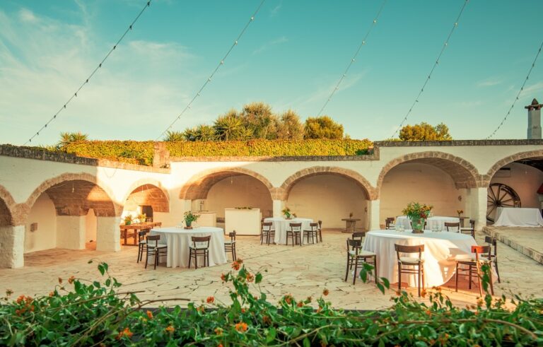 The courtyard under its arches, set for a reception, Masseria Spina Resort