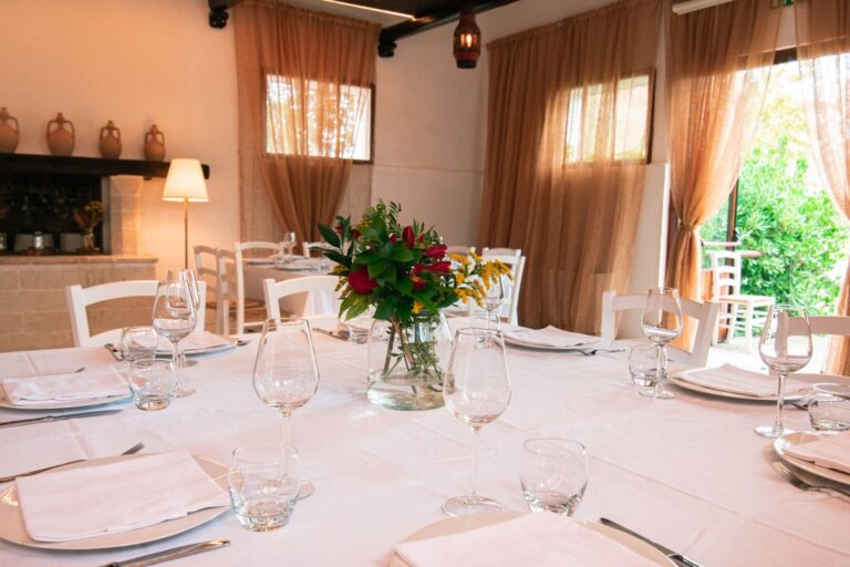 The Sala Fienile restaurant laid for dinner, Masseria Spina Resort
