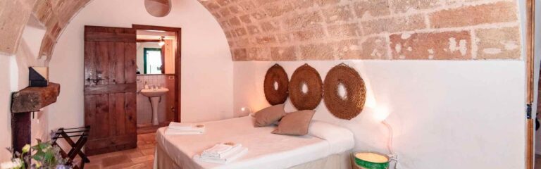 A bedroom in Il Fico, Masseria Spina Resort