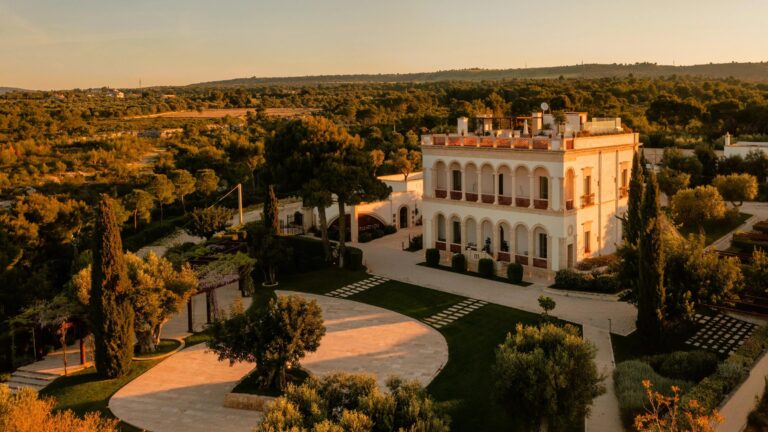 Aerial view of the estate and its gardens at golden hour, Mastropà