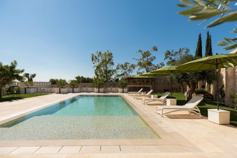 The saltwater pool with sun loungers, Mastropà