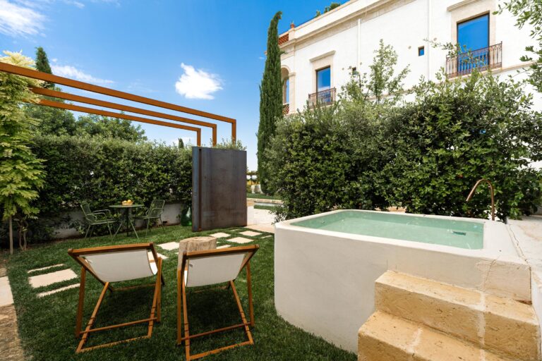 Private garden with a plunge tub at one of the Ancient Stables rooms, Mastropà