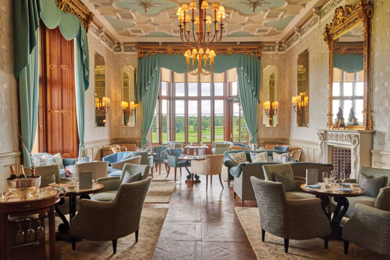 Afternoon tea set out in the Drawing Room, with views over the parkland through the bay window, Matfen Hall