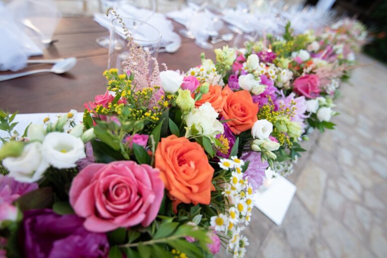Table runner of roses and mixed flowers in pink, orange and white, Mathioudakis Exclusive Events