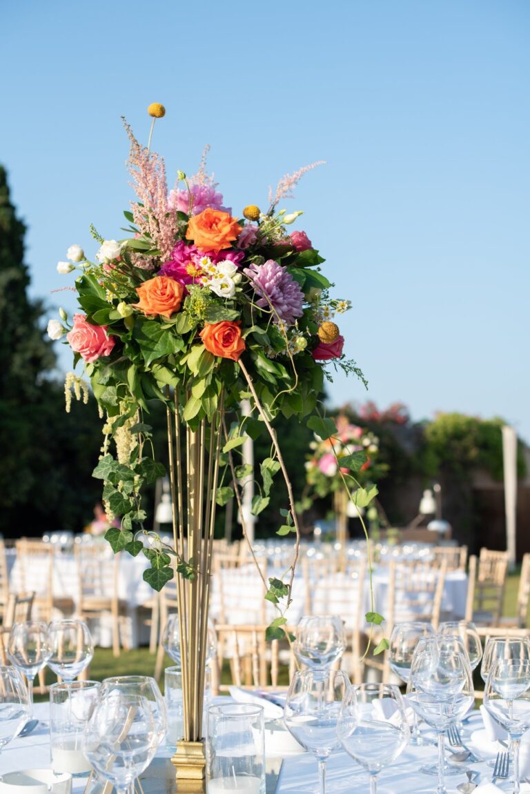 Tall floral centrepiece on a dining table, Mathioudakis Exclusive Events