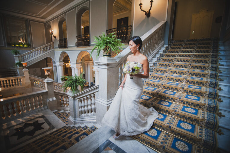 A bride on a grand carpeted staircase, from his Villa d'Este wedding page, Matteo Cuzzola Photography