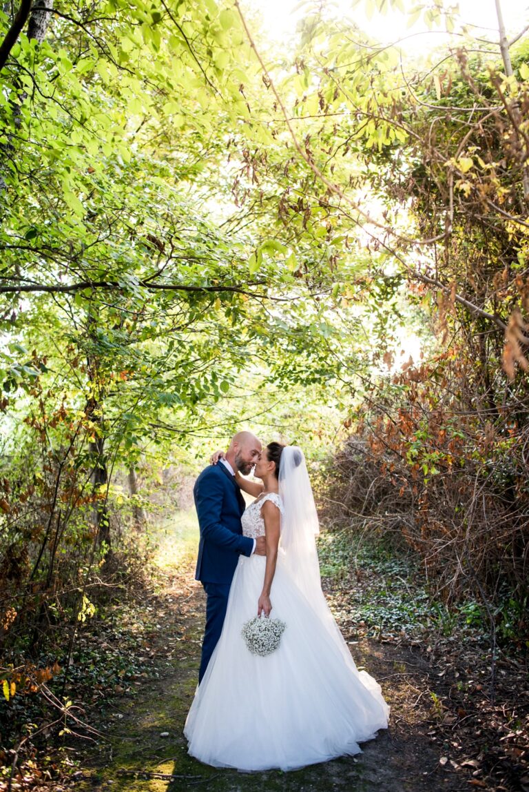Bride and groom kissing on a woodland path, from a wedding at Susans Castle, Majano, Friuli, Matteo Cuzzola Photography