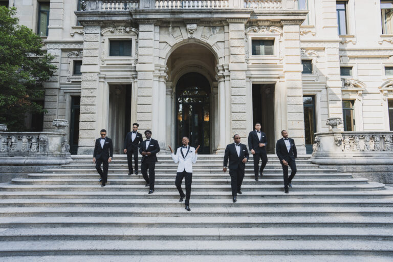 The groom and groomsmen coming down the front steps of Villa Erba, Cernobbio, Matteo Cuzzola Photography