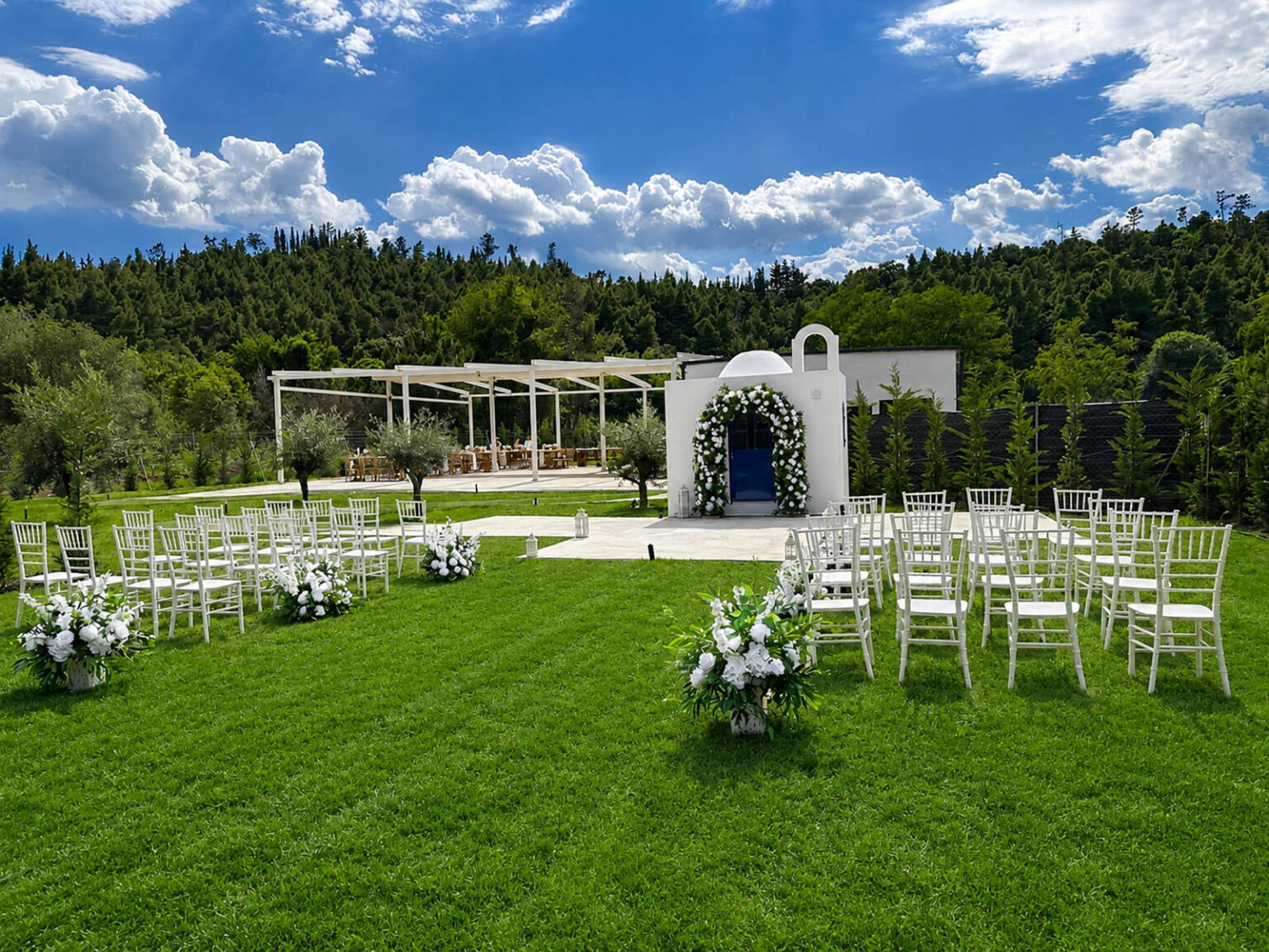 A lawn ceremony beside the white chapel