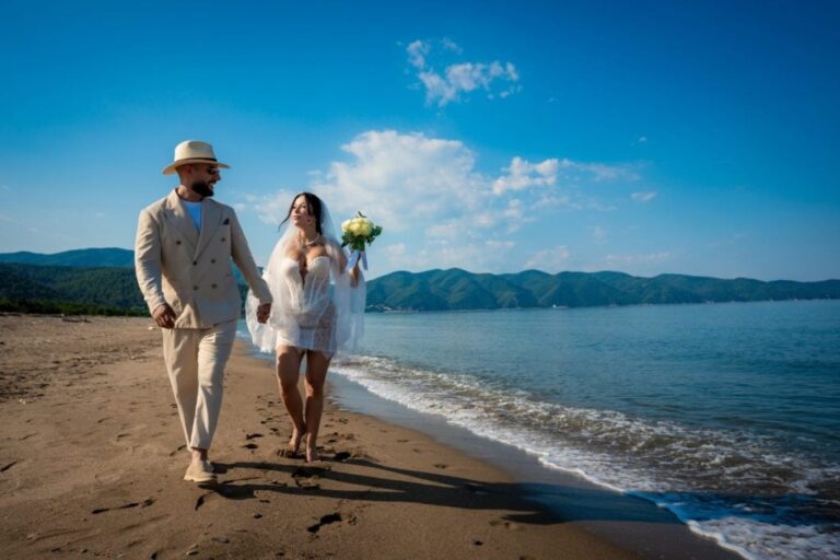 The couple walking along the shore, Mazal Weddings