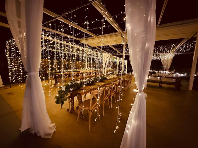 Draped covered area with lights for the evening party, Mazal Weddings