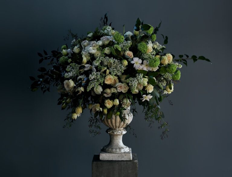 A tall arrangement of white rose and hydrangea, McQueens Flowers
