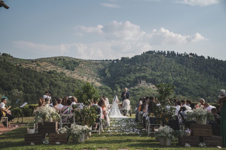 A garden ceremony with the Tuscan hills behind, for a London couple at Villa il Gran Duca, Michele Monasta Photography