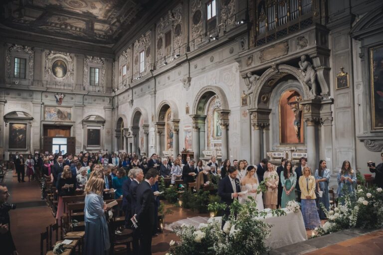 A wedding ceremony in the Church of Ognissanti in Florence, beneath its richly decorated walls, Michele Monasta Photography