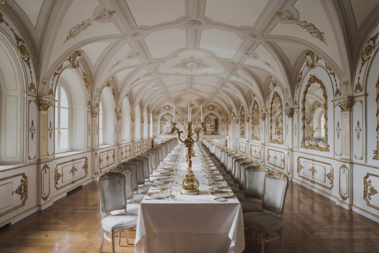 A long gilded gallery laid for dinner, photographed during an autumn elopement at La Corte dei Papi near Cortona, Michele Monasta Photography