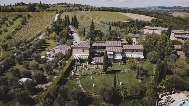 Borgo Argiano from the air, among vineyards and olive groves in the Tuscan countryside, Michele Monasta Photography