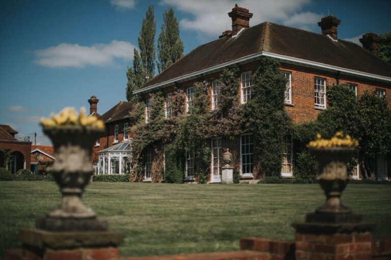 Micklefield Hall, the ivy-clad facade with stone urns, Micklefield Hall