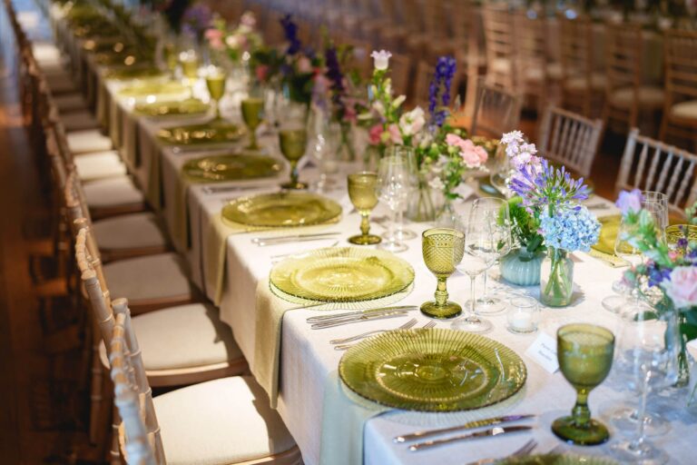 Long-table place settings, spring flowers and green glass, Micklefield Hall