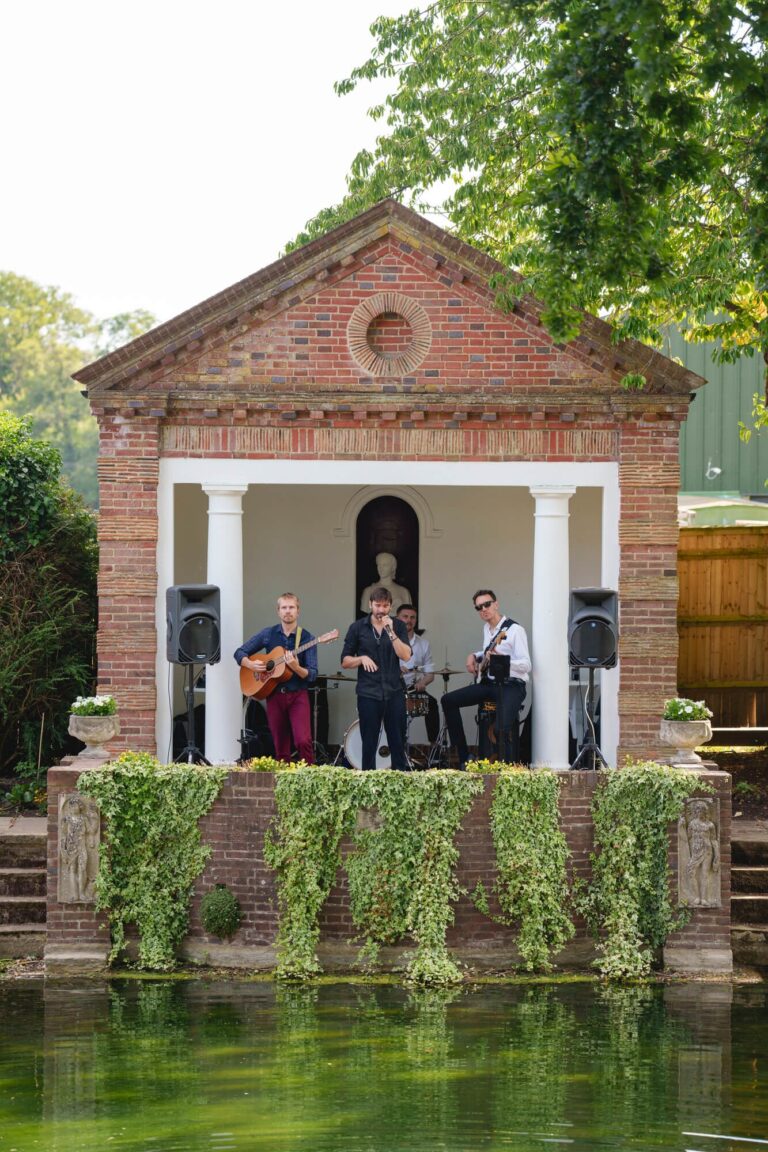 The Temple with live musicians, mirrored in the pond, Micklefield Hall