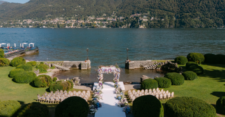 Garden aisle and floral arch beside the lake at a Lake Como wedding, Mitheo Events