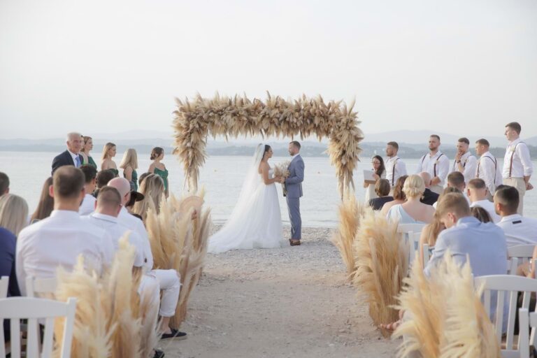 Beach ceremony beneath a pampas grass arch in Spetses, Mitheo Events
