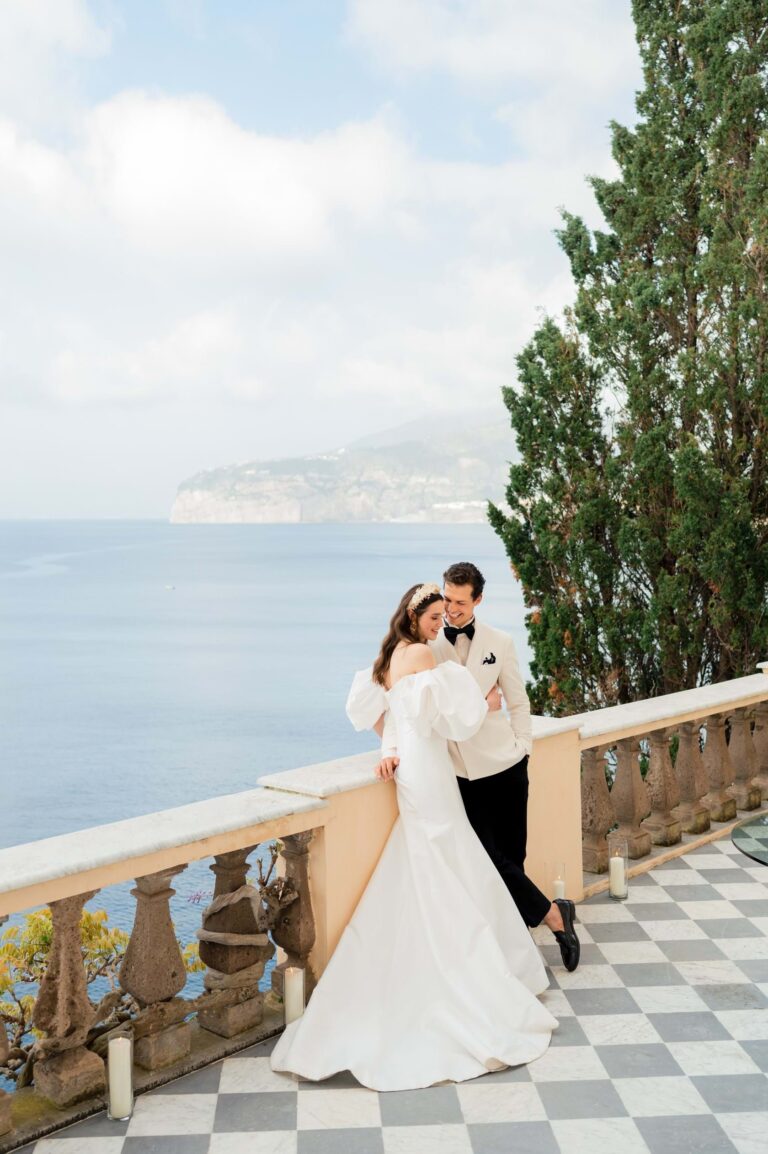 A couple on a balustraded terrace above the sea at Villa Astor, Mitheo Events