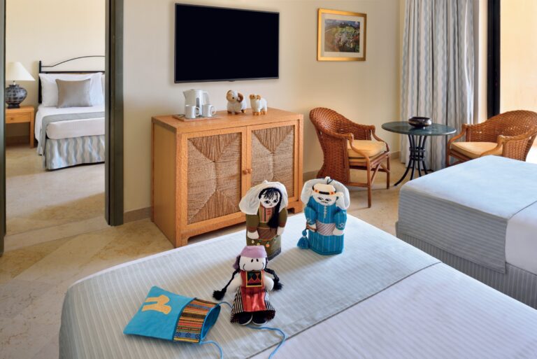 Family room with a bed and a connecting second bedroom beyond, Mövenpick Resort & Spa Dead Sea