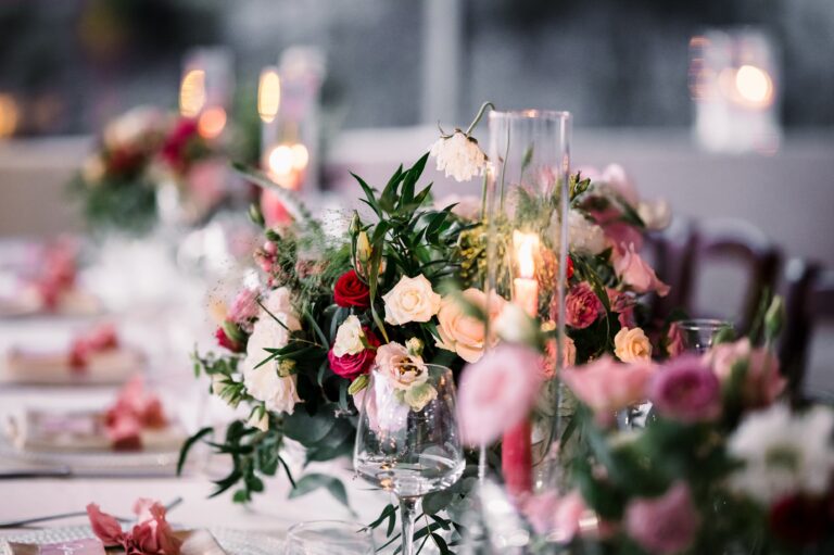 Table detail: pink tapers, garden roses and glass candle holders, Mr and Mrs Wedding In Italy