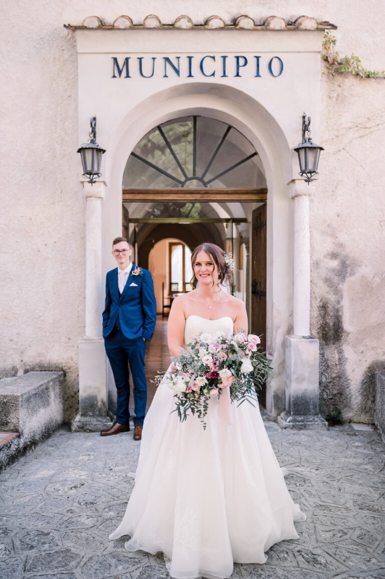 The couple in the doorway of the Municipio after a civil ceremony, Mr and Mrs Wedding In Italy