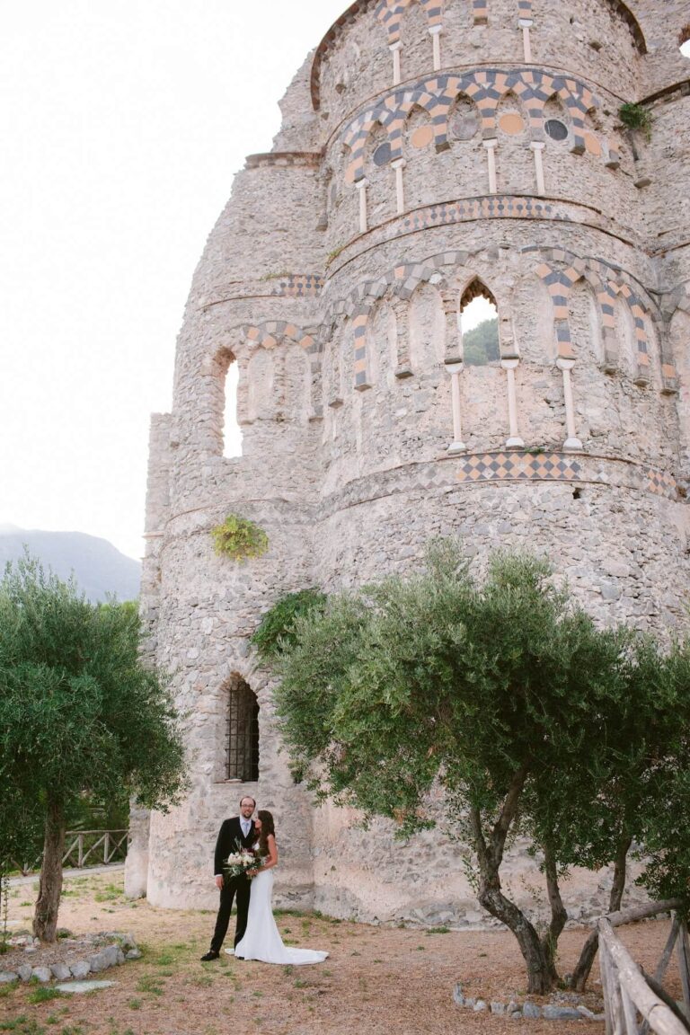 The couple at the ruins of a medieval basilica among olive trees, Mr and Mrs Wedding In Italy