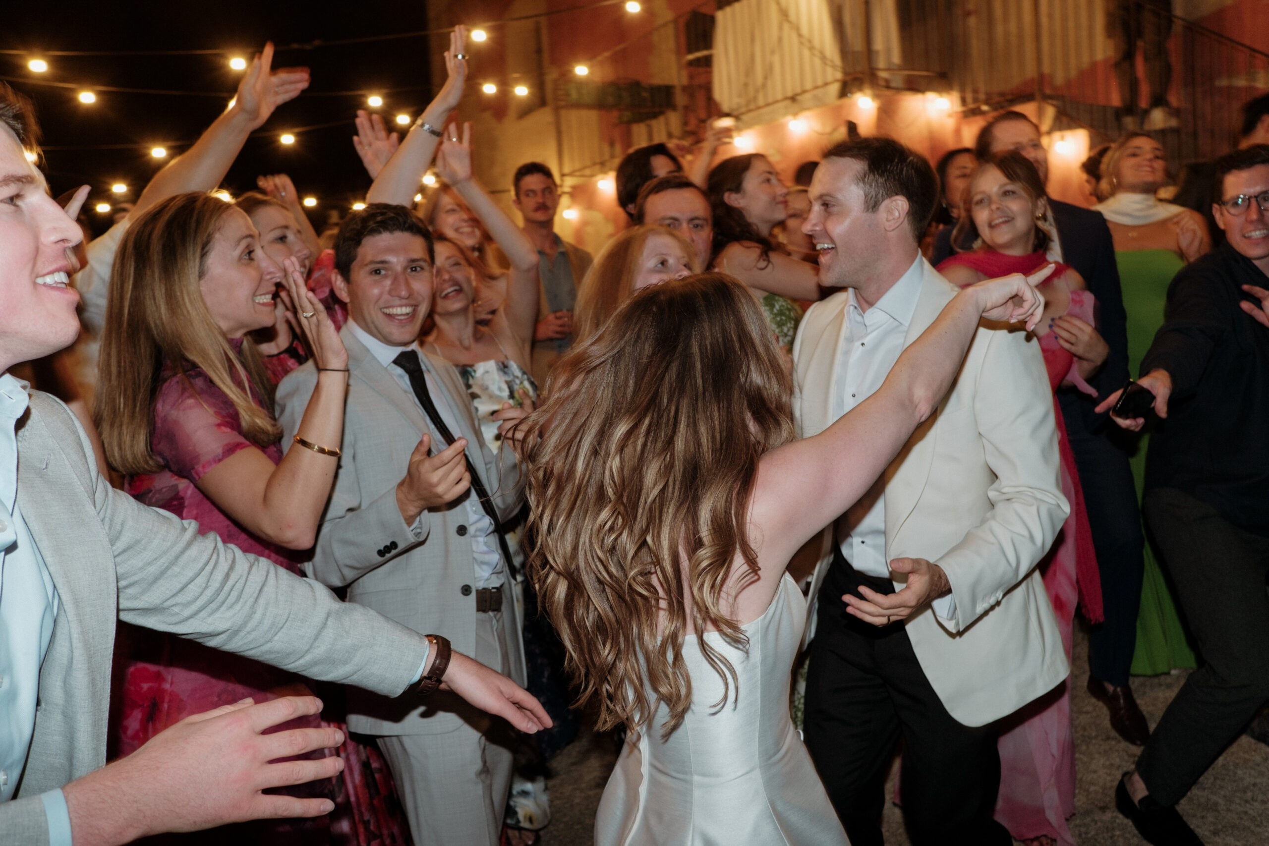 Dancing in the lane under strung lights, My Sicily Wedding